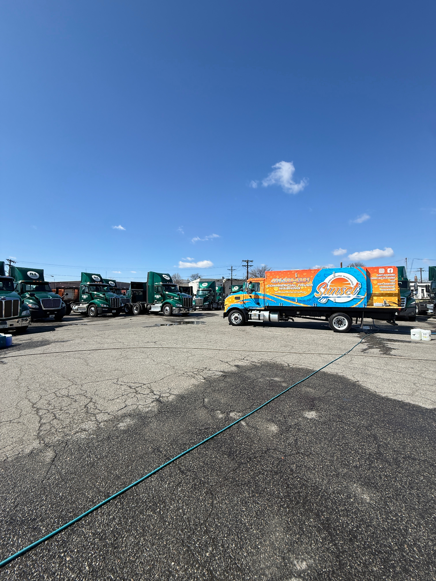 Sunset Pressure Washing branded commercial truck at a fleet washing job